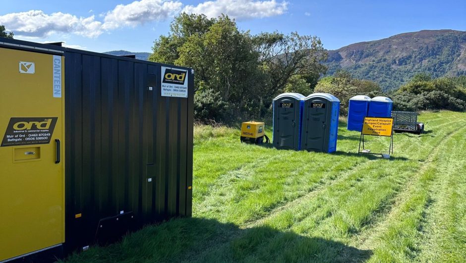 unites and toilets set up in a field from the ord group