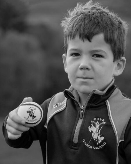 From Isabelle Law's 'Iomain' project. "Cailean: a future player of Skye Camanachd following his Dad and Grandfathers footsteps."