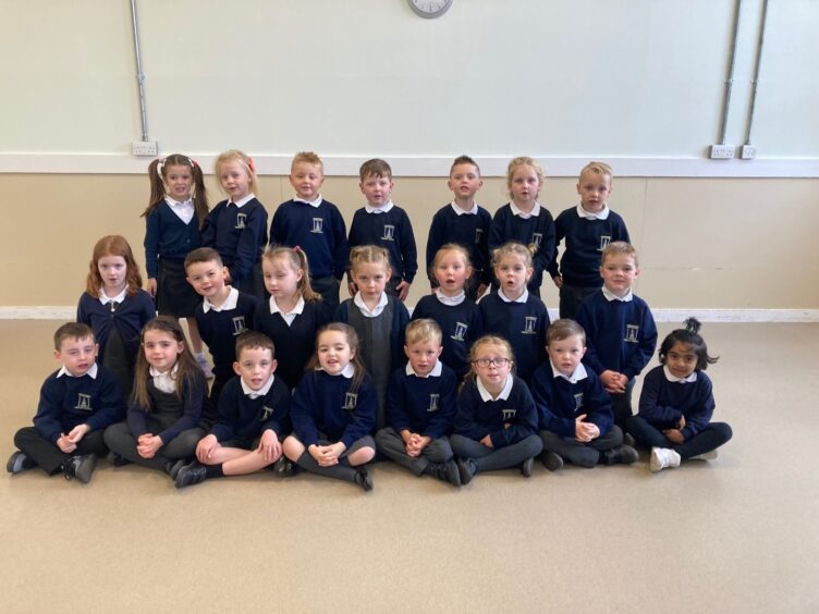 Andersons Primary School's class P1T in three rows