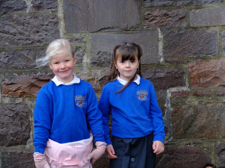 Two Applecross Primary School pupils standing outside