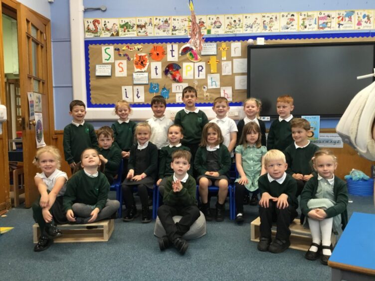 Moray schools Applegrove Primary School's first class of 2023, in three rows in their class room