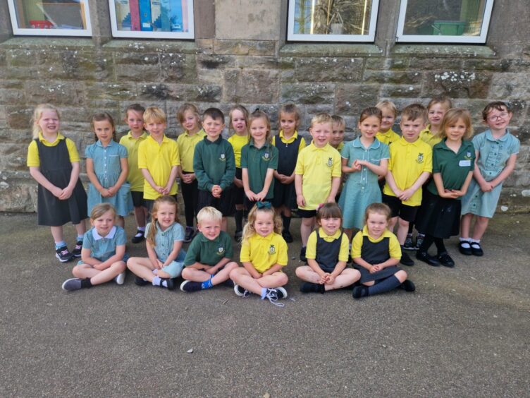 Auldearn Primary School's Primary 1 pupils in rows outside the school
