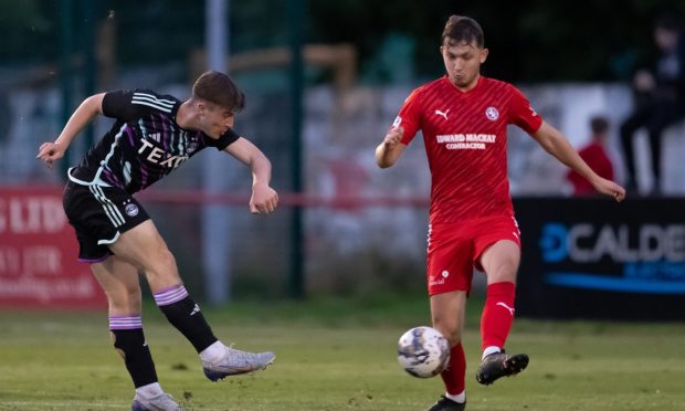 Alfie Bavidige, left, scoring for Aberdeen against Brora rangers in this season's PFL Trust Trophy. Image: Jasperimage