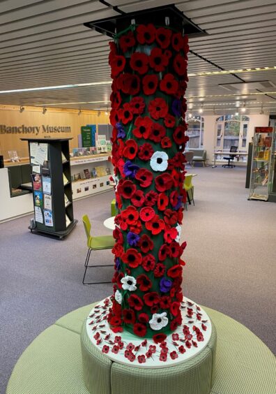Banchory poppy display made up of knitted and crocheted poppies. 