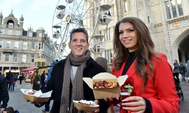 Andy and I with our chosen treats at the Aberdeen Christmas Village. Image: Darrell Benns/DC Thomson