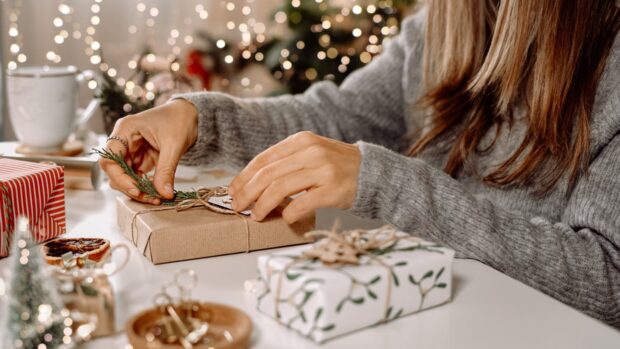 Woman wrapping Christmas presents.