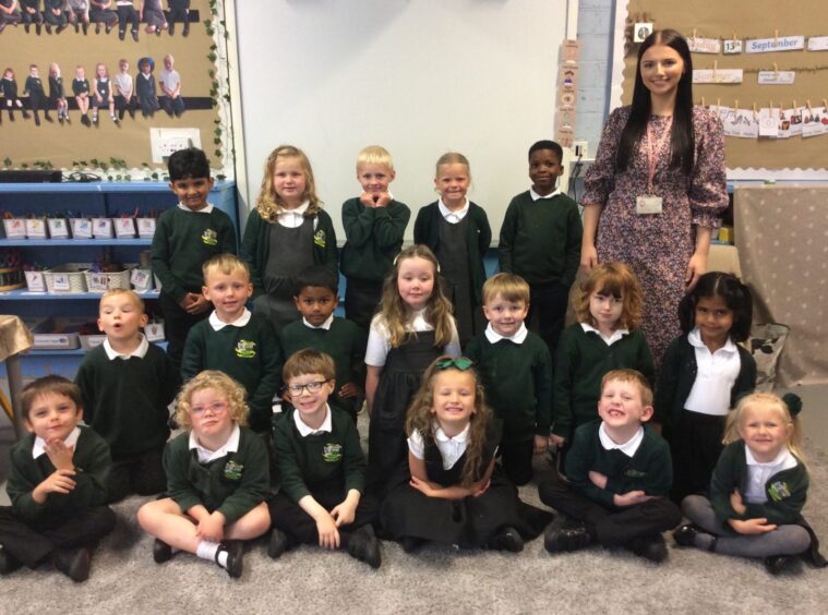 First class of 2023 at Cornhill Primary School in Aberdeen. The pupils are in rows with their teacher standing next to them
