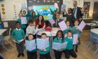 Councillor Martin Greig, Convenor of Education, Councillor Jessica Mennie, Vice Convenor Education and Ross Watson, Head Teacher, with pupils from Nursery and Primary 1 - primary 7 at Greyhope School and Community Hub. Image: ACC.
