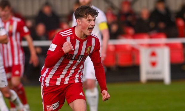 Formartine's Dylan Lobban, on loan from Aberdeen, celebrates after scoring a penalty to make it 1-0 against Brora. Image: Darrell Benns/DC Thomson