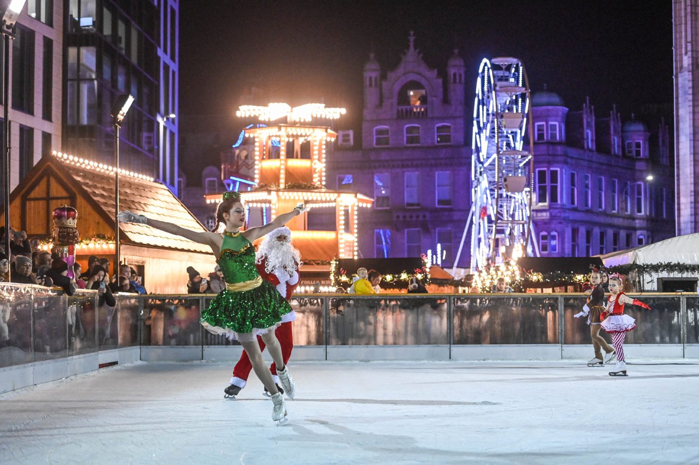Ice skaters in festive costumes on the ice rink at Aberdeen's Christmas Market, which has returned in 2023