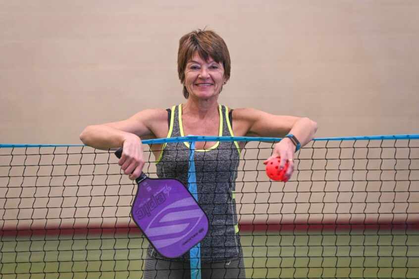 Anna Mauchline with her pickleball and racket 