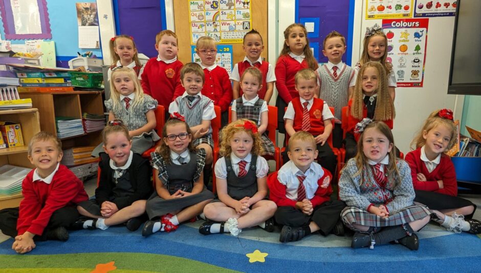 Dales Park Primary School's P1B in their colourful classroom