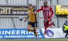 Formartine United's Julian Wade, right, puts pressure on Tom Lang of Falkirk during the Scottish Cup third round tie at the Falkirk Stadium. Pictures by Alan Rennie