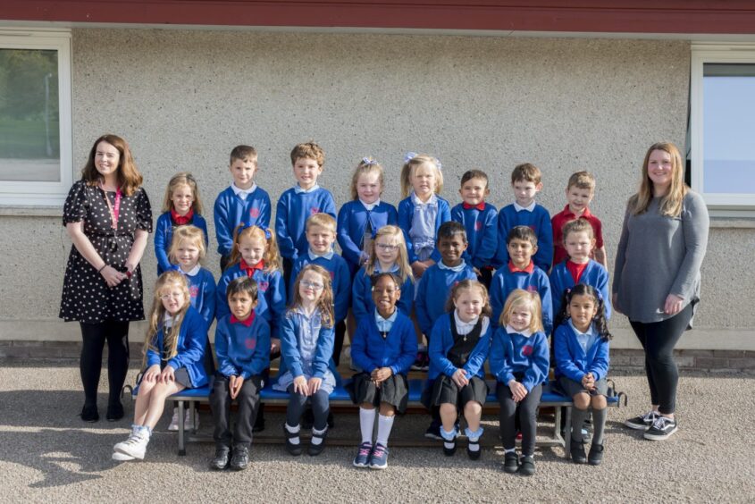 First class 2023 at Forehill Primary School in Aberdeen lined up in three rows with a staff member standing on either side