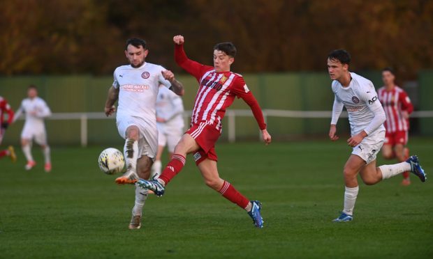 Formartine United v Brora Rangers in the Breedon Highland League at North LodgBrora Rangers' Ali Sutherland, left, challenges Dylan Lobban of Formartine United, centre.  Pictures by Darrell Benns/DCT Media