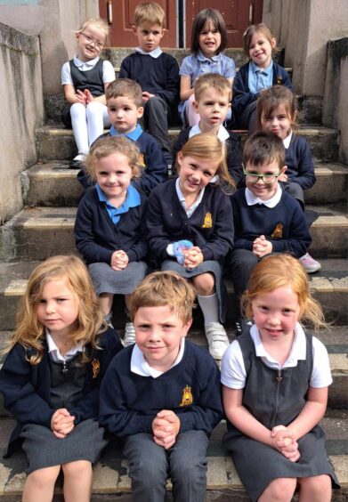 Golspie Primary 1 sitting on a set of stairs