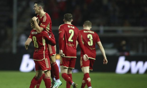 Aberdeen's Jamie McGrath, second left, celebrates after scoring against PAOK
