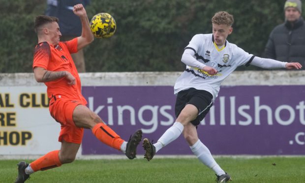 Callum Haspell of Rothes, left, blocks an effort from Lewis Mackenzie of Clachnacuddin. Pictures by Jasperimage