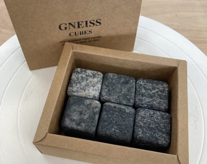 A set of uniquely-marbled polished stone cubes.