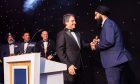 BME leader of the year Amitoj Singh, right, receives his award.