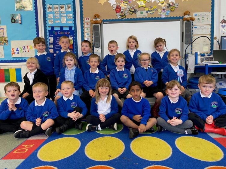 Insch School pupils in three rows in their classroom