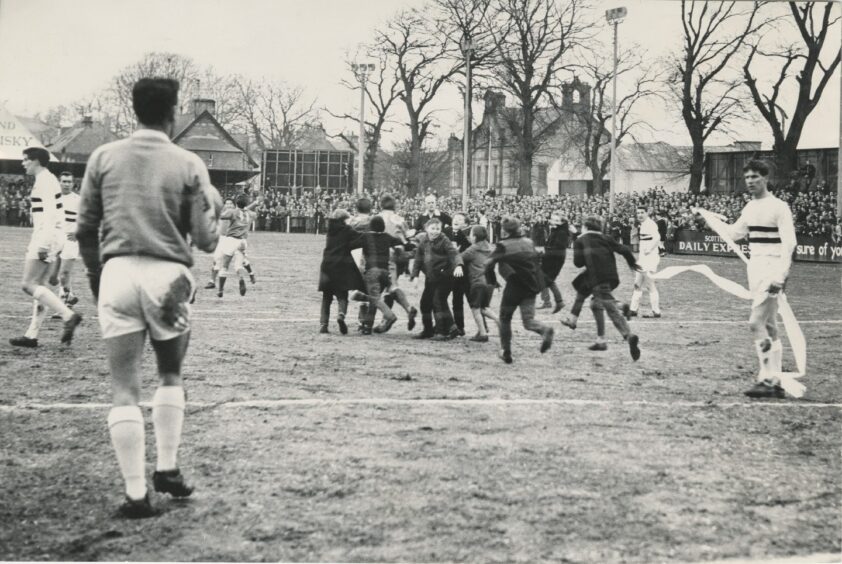 Inverness Caley fans storm the pitch in 1965.