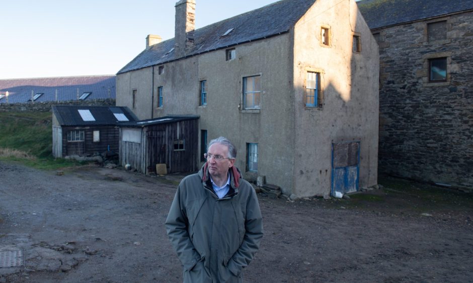 Paul Higson photographed outside the Marble Warehouse and the Workshop at Portsoy harbour.