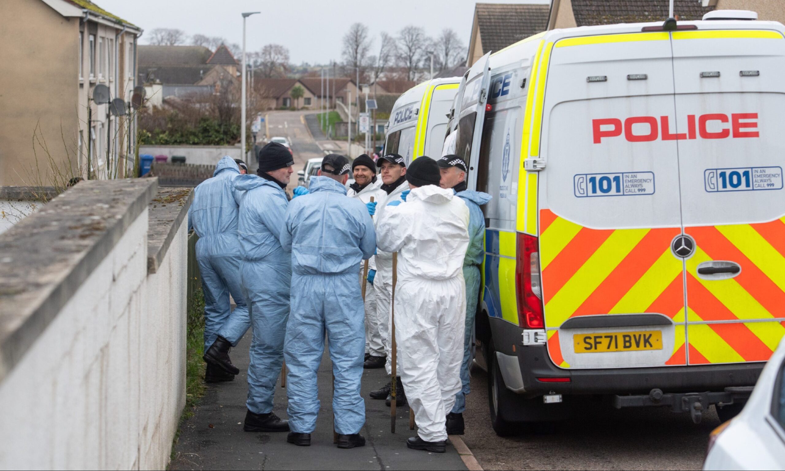 Forensic police officers in Elgin. 