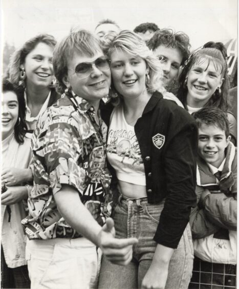 Adrian John (left) poses with fans after his Inverness road show. Supplied by DCT Archives.