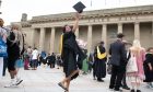 Pavithra Mesthrigie (MSc Industrial Engineering and Management), City Square, Dundee throwing her cap in the air.