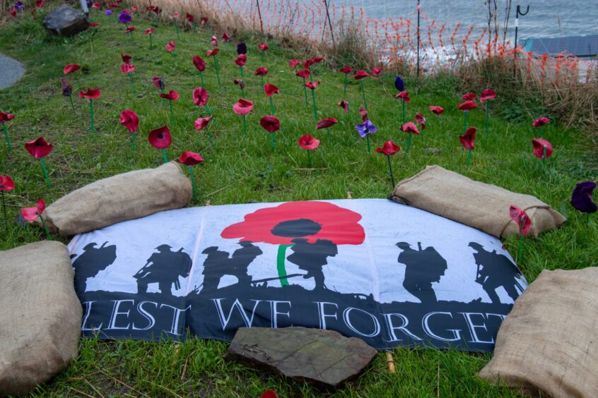 Lest We Forget remembrance flag features as part of the Macduff Poppy display.