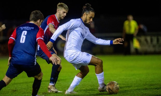 Banks o' Dee's Dayshonne Golding, right, tries to get away from Turriff United's Andrew Watt, centre, and Liam Strachan. Pictures by Kath Flannery/DCT Media