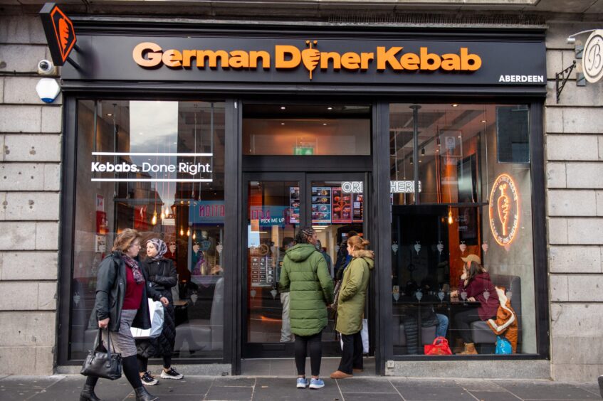 Customers entering the new German Doner Kebab on Union Street