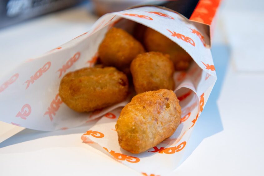 Chilli cheese bites in a paper package from German Doner Kebab on Union Street