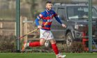 Thomas Borthwick after scoring for Kingussie. Image: Neil G Paterson.
