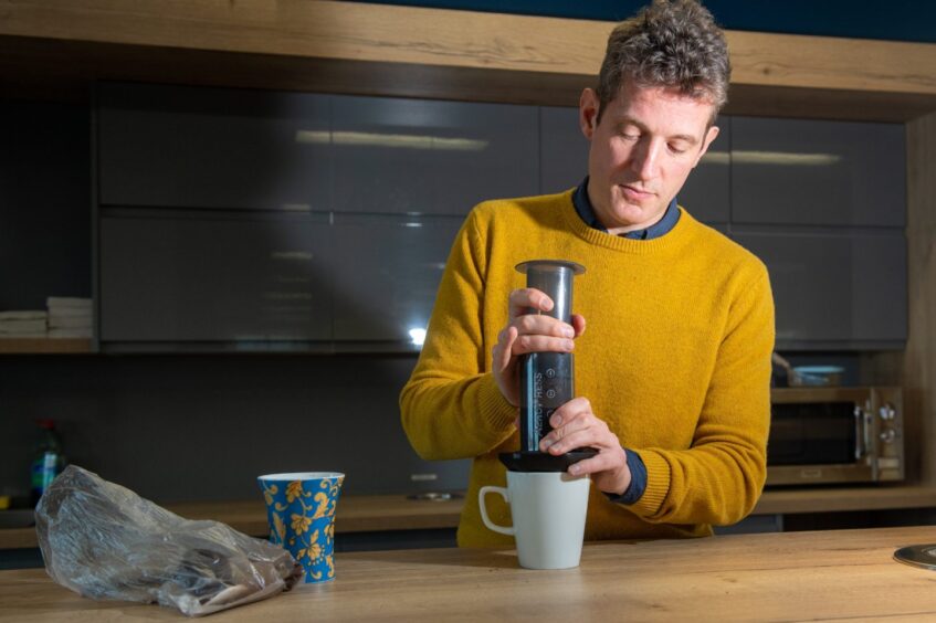 Andy Morton makes coffee with an Aeropress on a kitchen counter