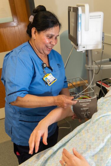 Nurse Marykutty at work in the cardiac ward at Aberdeen Royal Infirmary