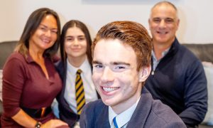 Aiden Leigh, 17, with a very proud family - mum Charmaine, sister Cara and dad Eddie. Image: Kami Thomson/DC Thomson