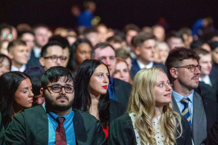 Aberdeen University Graduations sitting listening at P&J Live, Aberdeen. evening grad Business School.