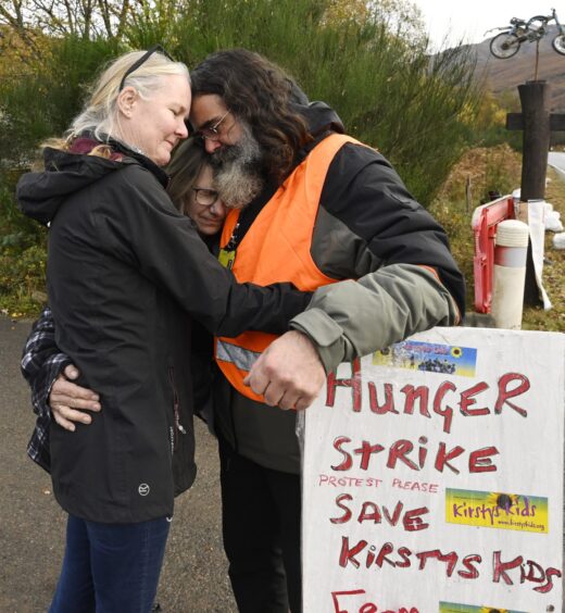 Kirsty's Kids charity founder John Bryden with sign that reads: 'Hunger strike, Save Kirsty's Kids'.