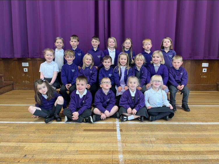 class P1A in the PE hall at Lochardil Primary School in Inverness