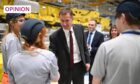 Chancellor of the Exchequer Jeremy Hunt meets factory workers in North Wales following his autumn statement. Image: Oli Scarff/PA Wire