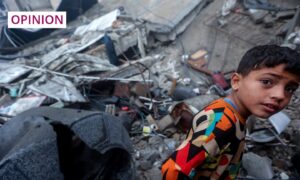A young Palestinian boy surrounded by rubble in the Gaza Strip. Image: Ahmed Zakot/SOPA Images/Shutterstock