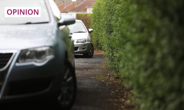 Parking on pavements can force wheelchair users or people with buggies into the road. Image: Mhairi Edwards/DC Thomson