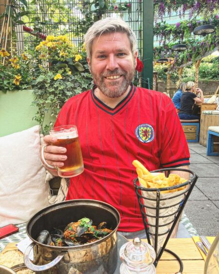 Comedian Mark Nelson enjoying a drink before a recent Scotland match.