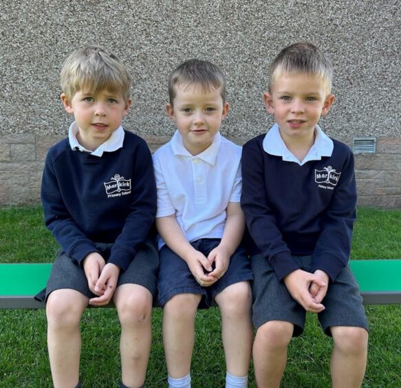 Three P1 pupils at Marykirk Primary School.