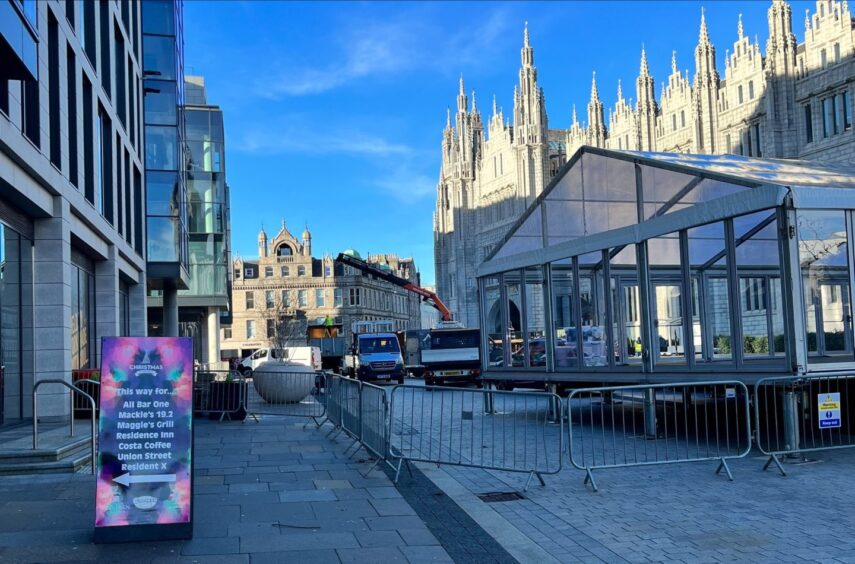 Barriers in place and work underway to set up Aberdeen Christmas Village.