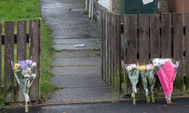 Floral tributes laid at the gate of murder victim Kiesha Donaghy.
