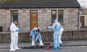 CR0045947
22 November 2023. Anderson Drive area,New Elgin,Elgin,Moray,Scotland. This shows the Police ativity in the Murder Scene area, with search officers searching Drains and CID doing house to house enquries. Credit - Jasperimage
This is the search teams opening up drains, emptying contens and searching for evidence.