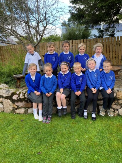 Two rows of P1 pupils outside Newtonmore Primary School.